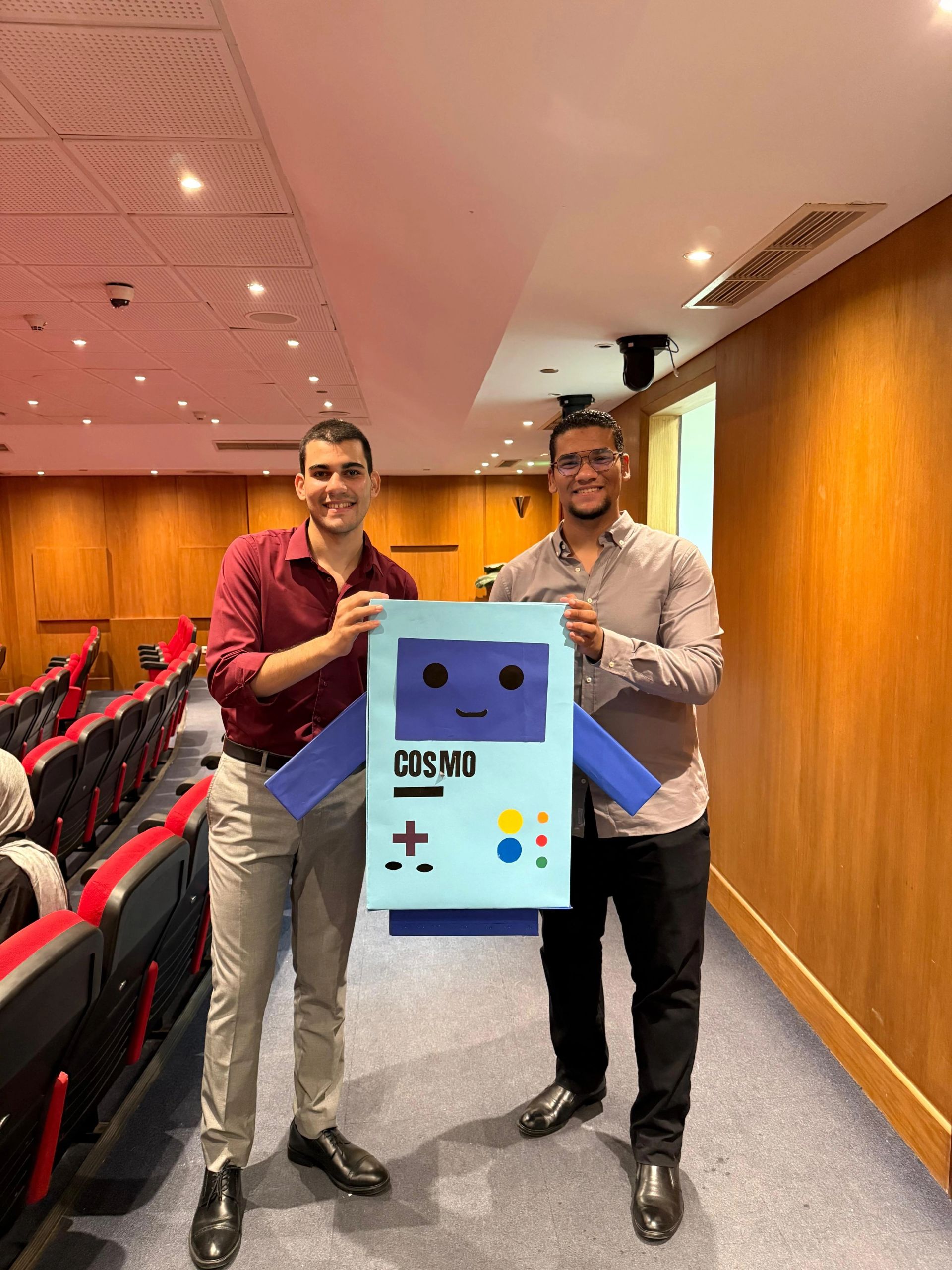 LLM Engineering Bootcamp: From Foundations to Deployment: Moaz and Mohamed with robot