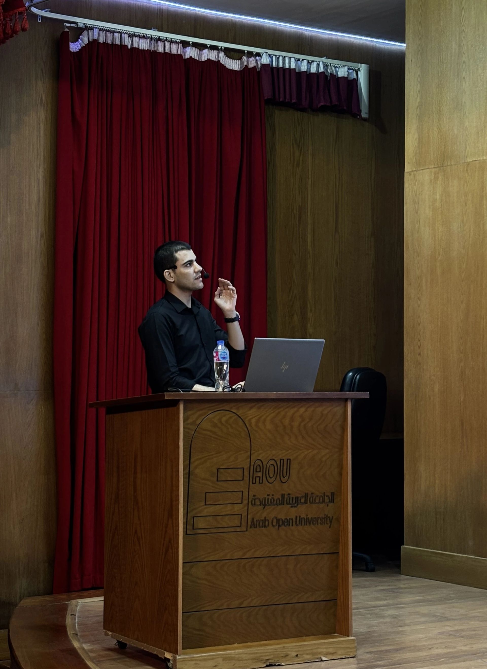 LLM Engineering Bootcamp: From Foundations to Deployment: Moaz on stage looking at the screen