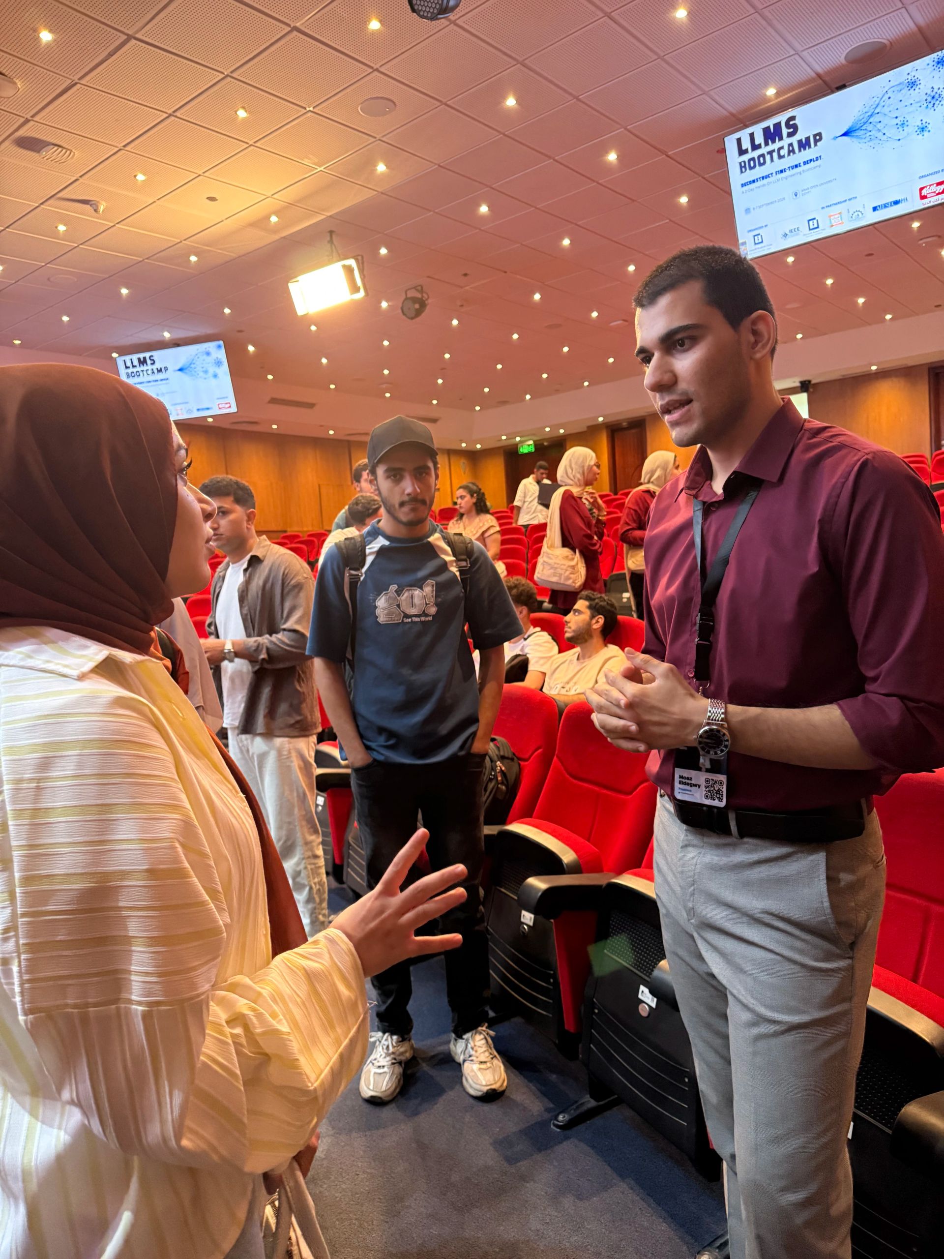 LLM Engineering Bootcamp: From Foundations to Deployment: One of the attendees asks Moaz a question after the lecture