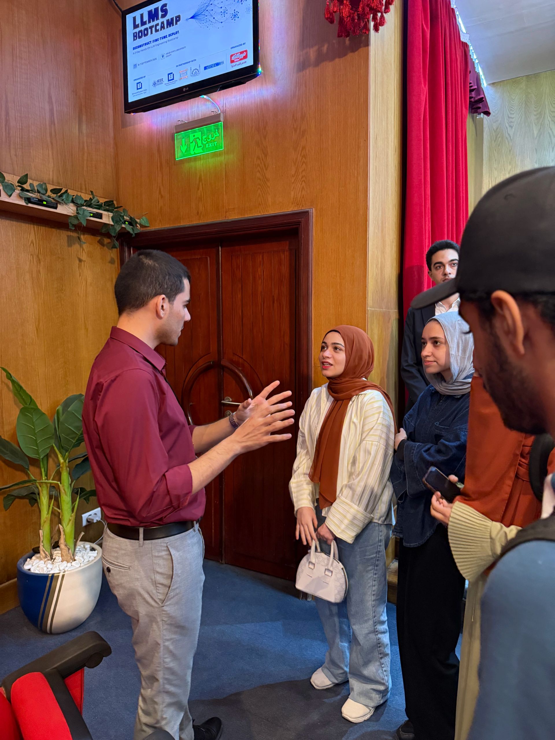 LLM Engineering Bootcamp: From Foundations to Deployment: One of the attendees asks Moaz a question after the lecture